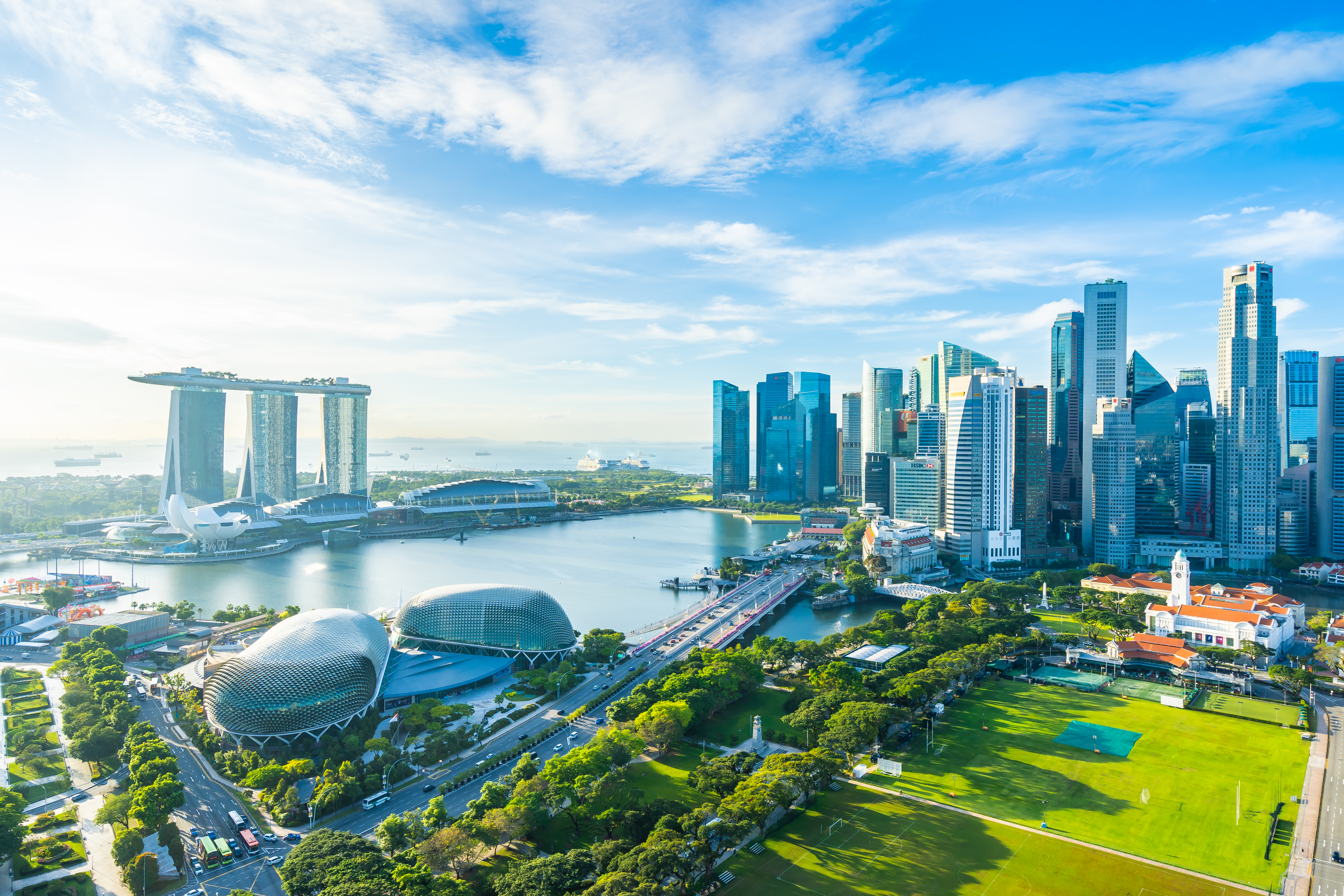 Beautiful architecture building exterior cityscape in Singapore city skyline with white cloud on blue sky